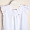 Body de algodón combinado con broderie de algodón en el canesú y dije de nacar Anto
