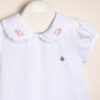 Body de algodón pima peruano con cuello bordado y dije con logo Nani