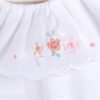 Body de algodón pima peruano con cuello de voile bordado y dije con logo Alma