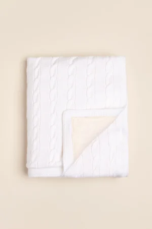 Manta con tejido de trenzas forrada con pielcita Soft